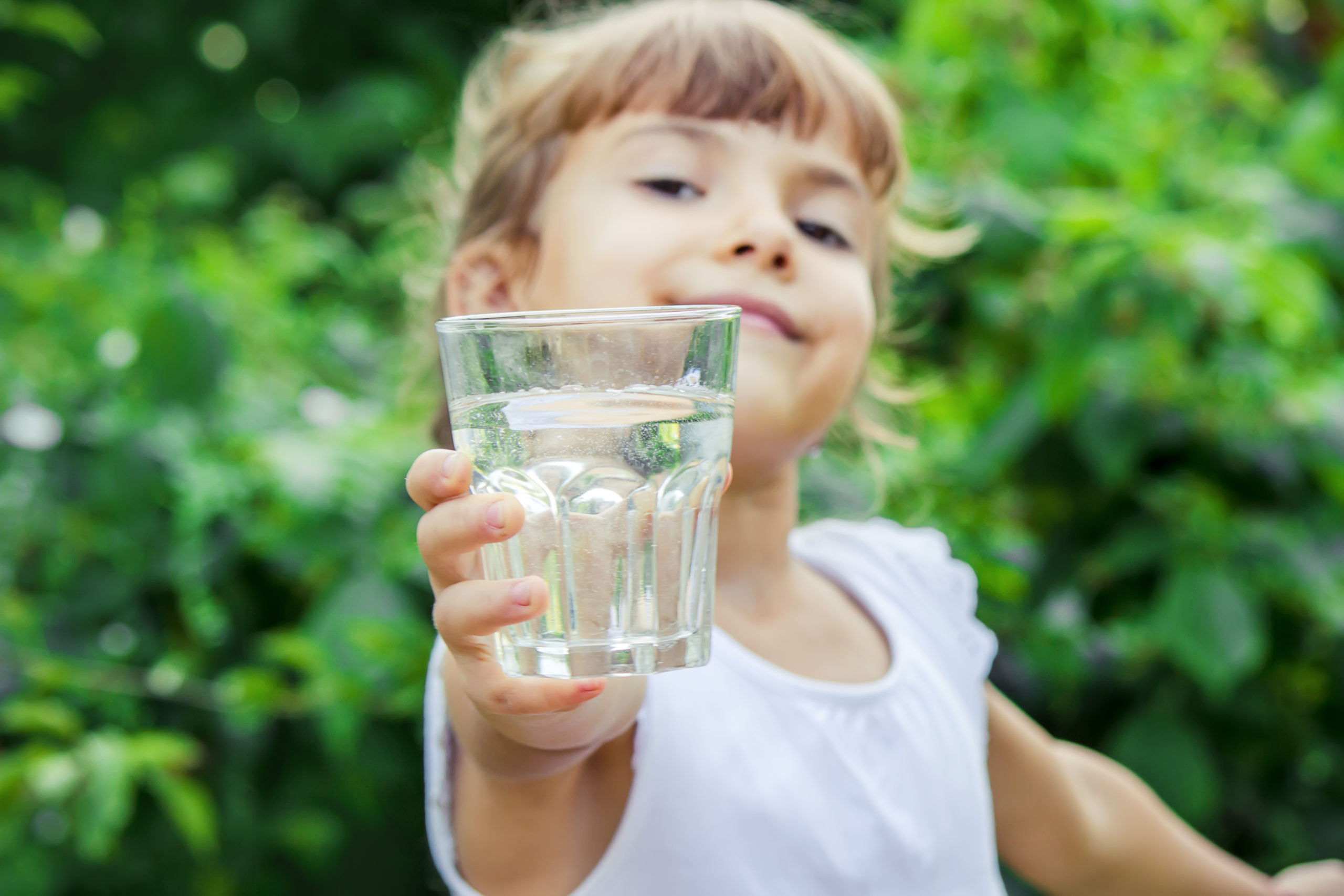 child glass of water. selective focus. nature.